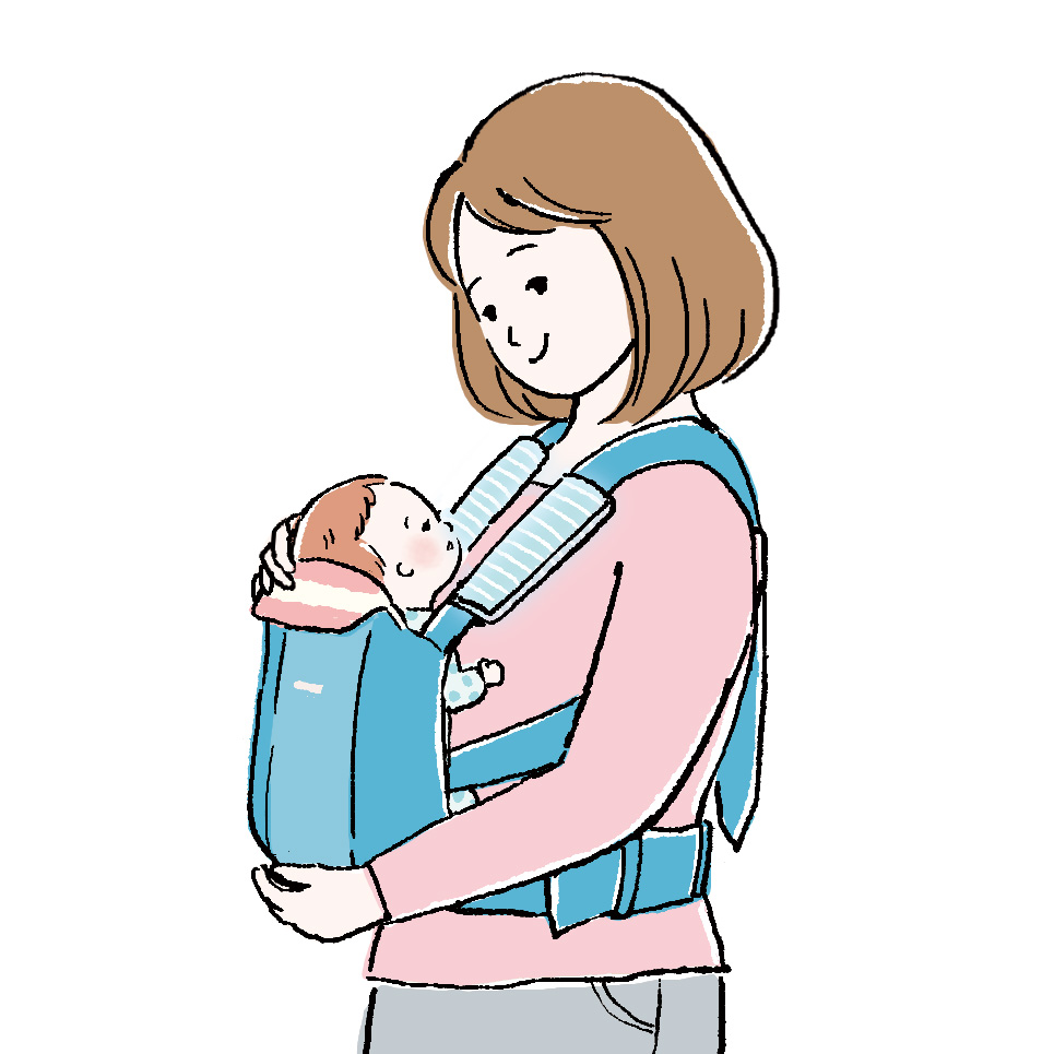 抱っこ紐をつけるママ